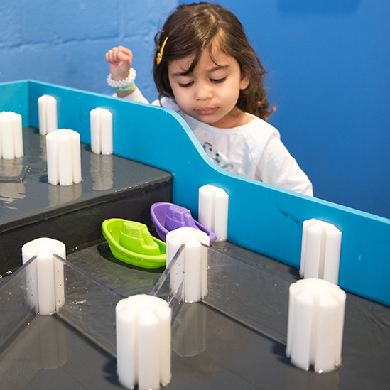 children playing with the sluice way